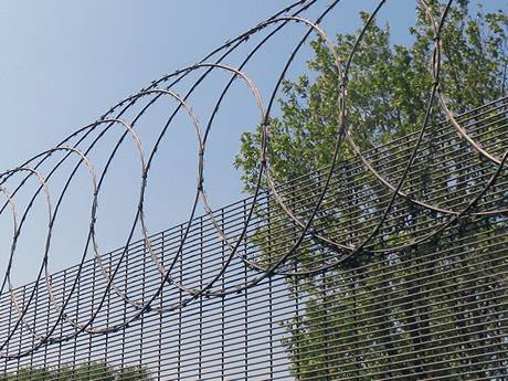 The flat wrap razor wire are attached at the top of 358 mesh fence panel.