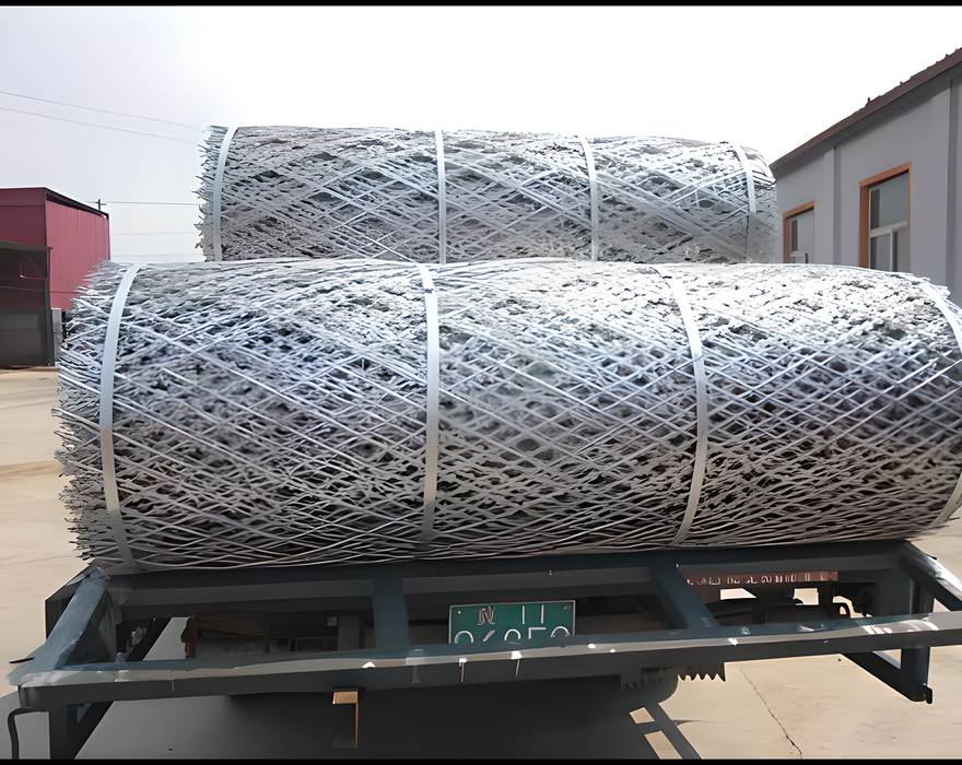 Two rolls of welded razor wire mesh on the truck.