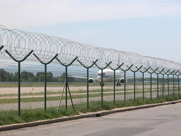 the BTO-22 barb tapes are installed at the top of airport fencing.